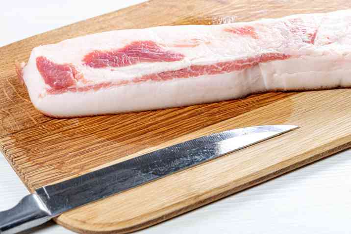 raw lard with knife